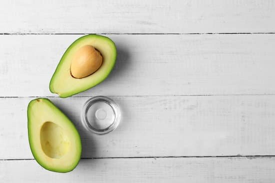 canva fresh avocado oil and fruit on wooden table MAD Qgui8OE