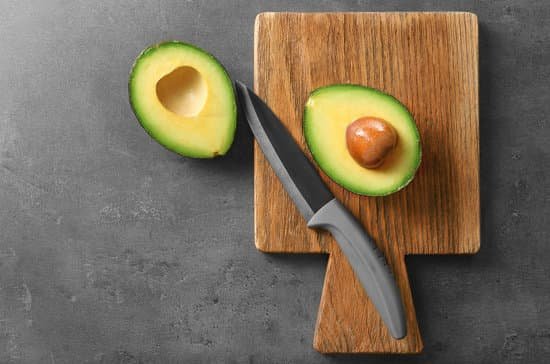 canva fresh avocado on cutting board MAD QtE8VYQ