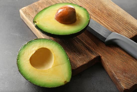 canva fresh avocado on cutting board MAD QtvcYz0