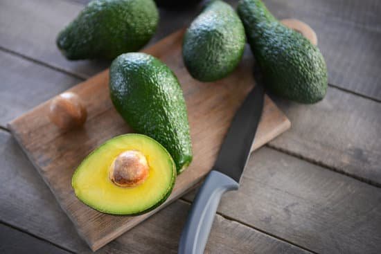 canva fresh avocado on cutting board MAD QvbpCJk