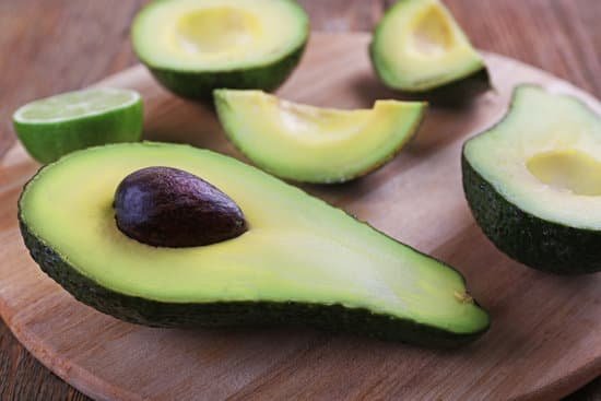 canva fresh avocado on wooden cutting board closeup MAD QknZrcI