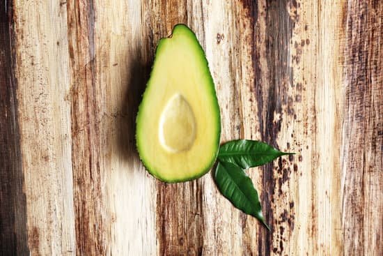 canva fresh avocado on wooden table top view MAD Qk1FPJw