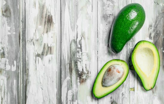 canva fresh avocado slices on wooden background MAEPYDeE sA