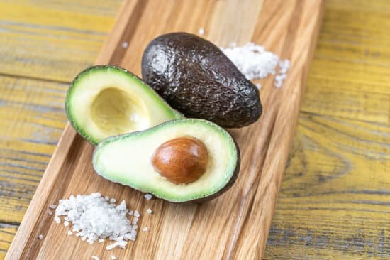 canva fresh avocado with rock salt on wooden tray MAD9E PUQpM
