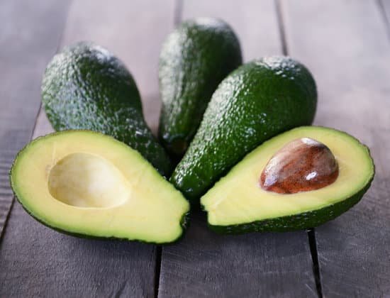 canva fresh avocados on wooden background MAD QqNV yU