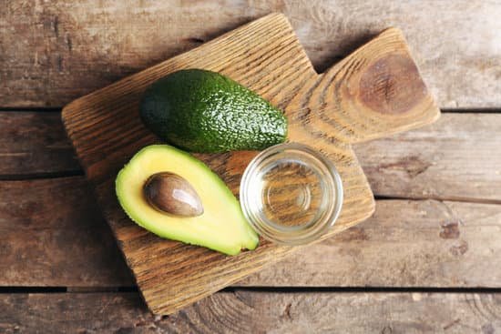 canva fresh avocados on wooden board top view MAD Qiep1uc
