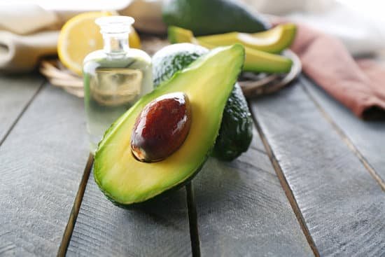 canva fresh avocados on wooden table close up MAD QlPDzTg