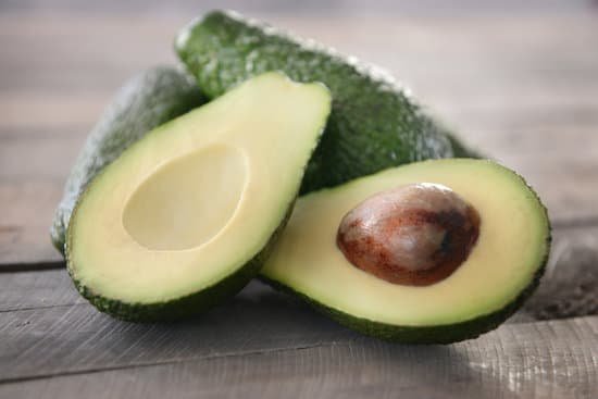 canva fresh avocados on wooden table close up MAD QsdT1OA
