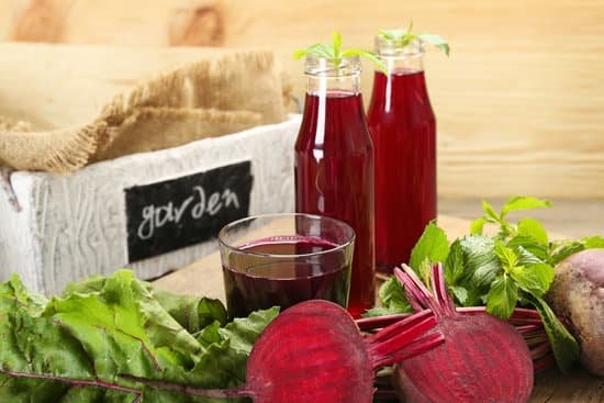 canva fresh beet juice on a wooden table MAD MdRshiw