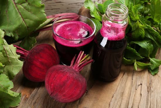 canva fresh beet juice on wooden table closeup MAD MU KGDA