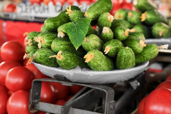 canva fresh cucumbers at a market display MAD9T5nT4Ic