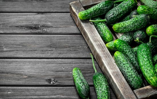 canva fresh cucumbers on a wooden tray MAEPiXVo5Mk