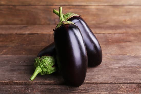 canva fresh eggplant on wooden table MAD MRs6iyw