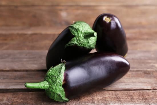 canva fresh eggplant on wooden table MAD MVjR8 4