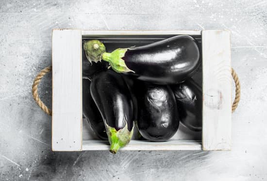 canva fresh eggplants on wooden crate MAEPLtFKVm8