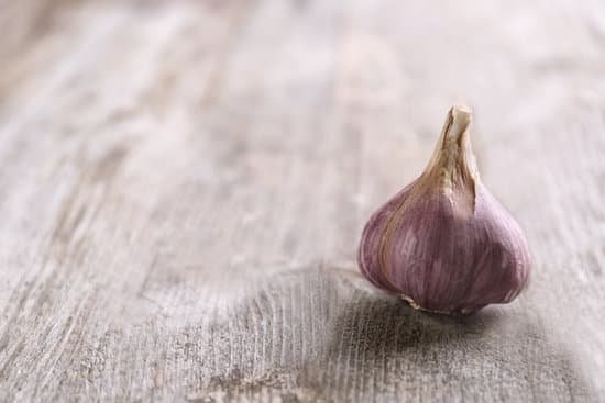 canva fresh garlic on wooden background MAD76urTpSM