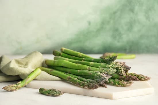 canva fresh green asparagus on table MAD8y5F9ylw