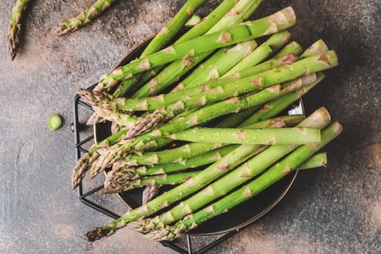 canva fresh green asparagus on table MAD8yzcj4p4