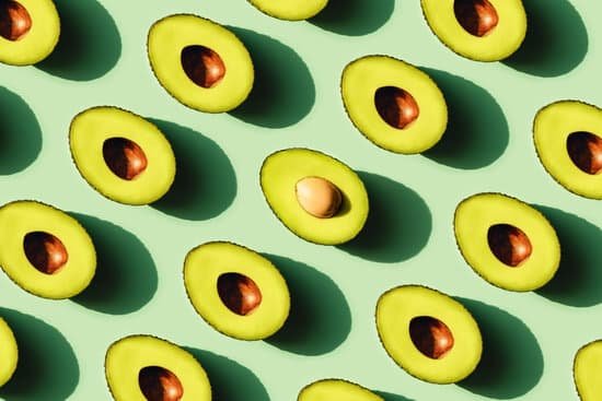 canva fresh halved avocados on green background MAD84g22qbY