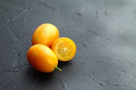 canva fresh kumquat fruit on black background MAELbSBMkTM