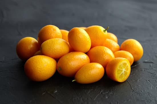 canva fresh kumquat on black background