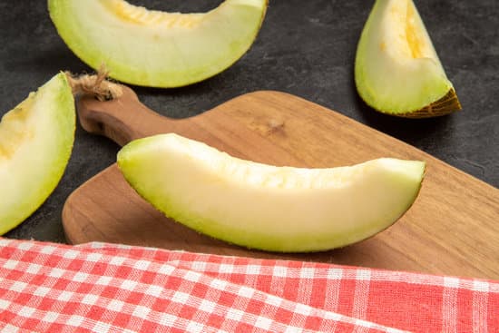 canva fresh melon slices on wooden cutting board MAEQX5q4VOs