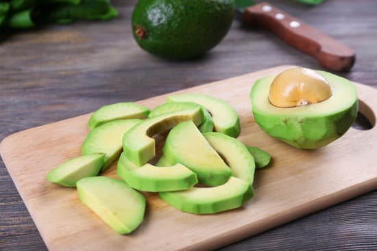 canva fresh sliced avocado on cutting board MAD QhsLqRg