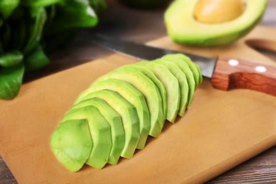 canva fresh sliced avocado on cutting board MAD QpfHHDc