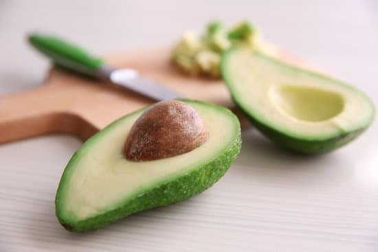 canva fresh sliced avocado on cutting board MAD QtwOZP8