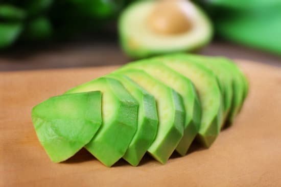canva fresh sliced avocado on cutting board close up MAD QoKT8KA