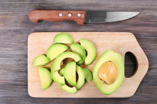 canva fresh sliced avocado on cutting board top view MAD QkMcHyk