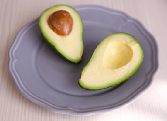 canva fresh sliced avocado on plate MAD Qo EE50