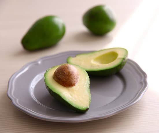 canva fresh sliced avocado on plate MAD QovAaq4