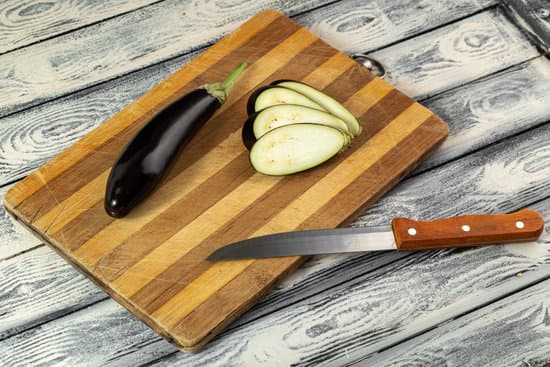 canva fresh sliced eggplant on wooden board MAD70sI34UQ