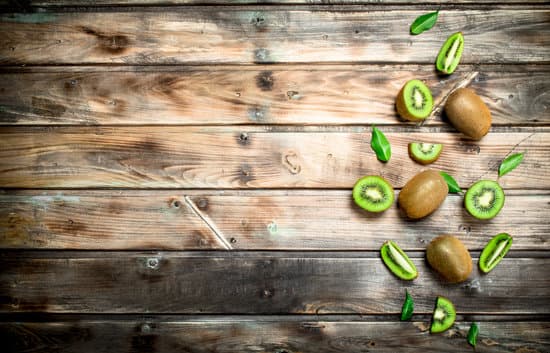 canva fresh sliced kiwi on wooden background copy space MAEP6g FGj0