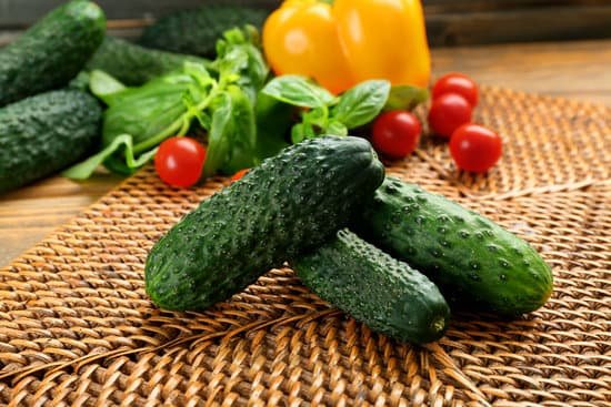 canva fresh whole cucumbers on wicker mat MAD MqBvyhI