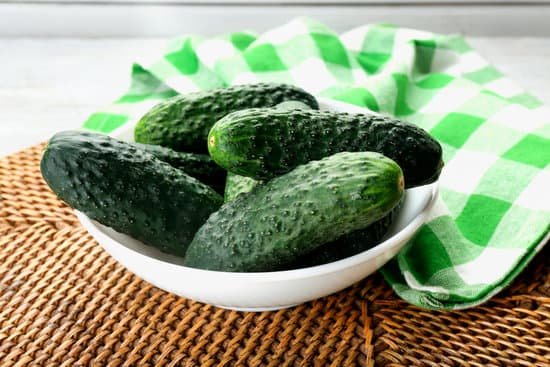 canva fresh whole cucumbers with green checkered napkin on bamboo mat MAD MpH7n0o