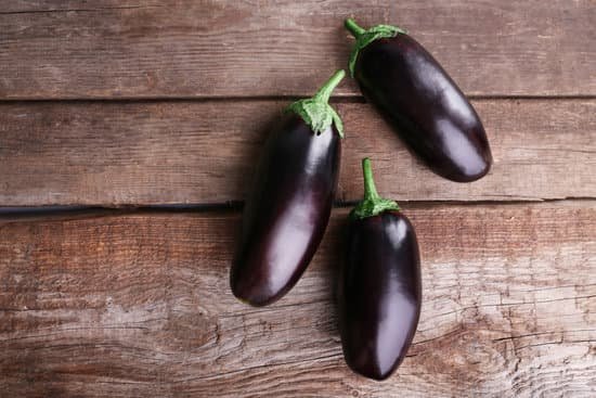 canva fresh young eggplants on wood MAD MSkJyGU