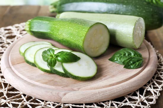 canva fresh zucchini with squash and basil on table MAD MRRnquM