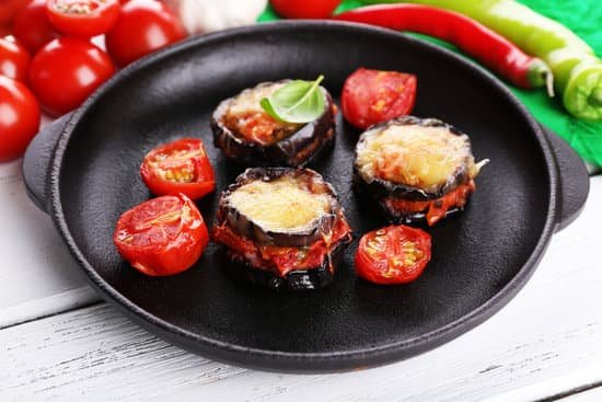 canva fried eggplant and tomatoes in a pan MAD MfntQGY