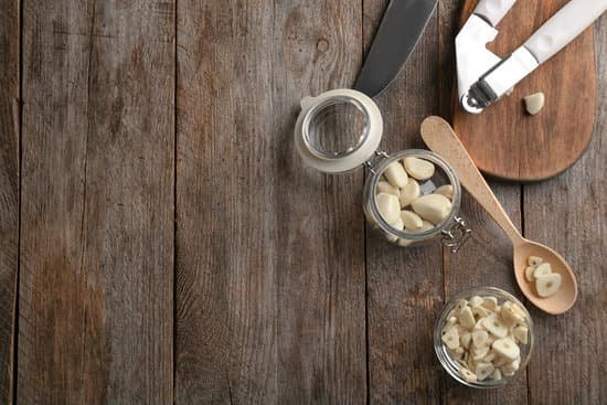 canva garlic and kitchen utensils on wooden background MAD76nJ0ujg