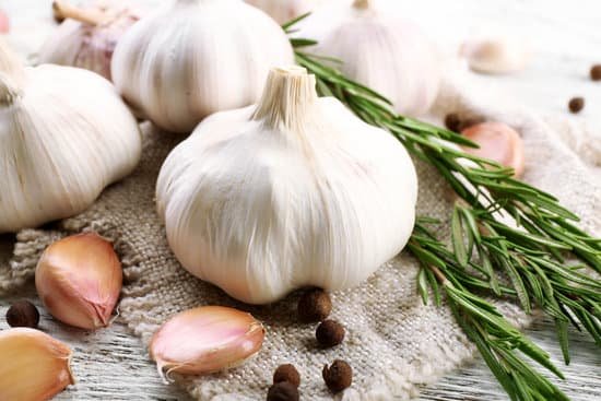 canva garlic and rosemary on a cloth MAD 76ONtGM