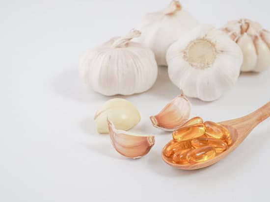 canva garlic with gel capsules on white background MAERD9lDWyo