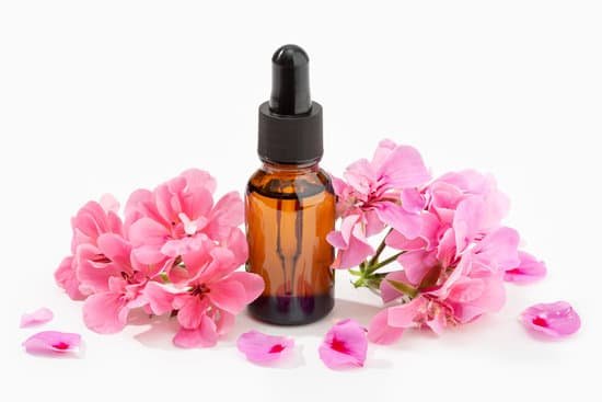 canva geranium essential oil in an amber bottle MAEAjEBUjPI