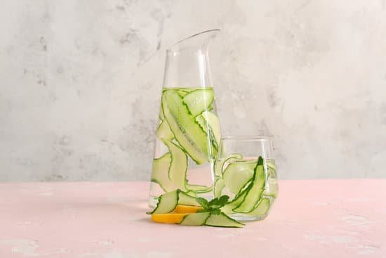 canva glass and pitcher of cucumber infused water MAD7Fes3MHE