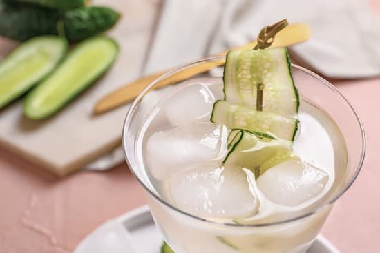 canva glass of cucumber martini placed on a table MAD7pIrX0JI