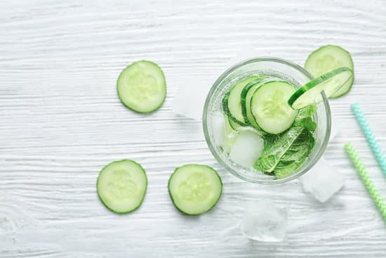 canva glass of fresh cucumber lemonade on wooden background MAD9bH2fpzU