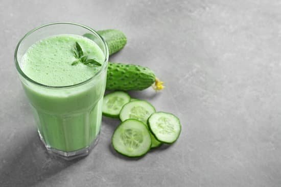 canva glass of fresh smoothie and cucumbers on table MAD9btk2LqU
