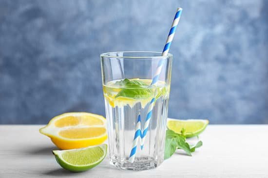 canva glass with basil water and fruits on table MAD9T4r nz0