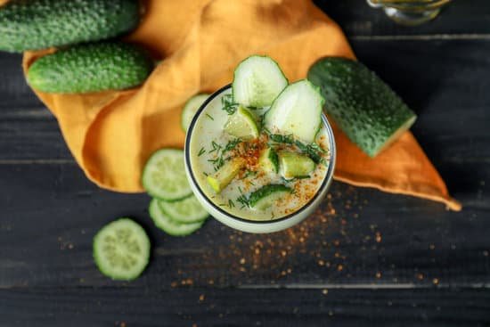 canva glass with cold cucumber soup on table MAD704PNdZc